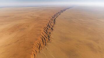 Aerial view of expansive desert landscape showcasing prominent ridge formation photo