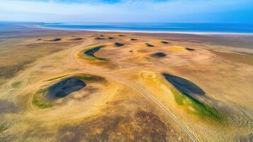 Aerial view of vast landscape with unique hills and serene coastal horizon photo