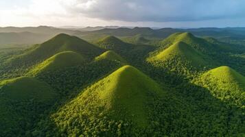 Aerial view of green hills in lush tropical forest landscape photo