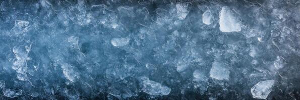 Textured ice surface with crystallized patterns and frozen features photo
