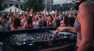 Female DJ Performing at Live Music Event Before Cheering Crowd photo