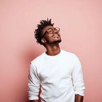 A young man with dreadlocks is looking up photo