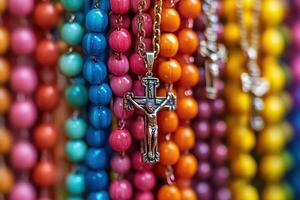 A row of colorful beads with a cross on it photo