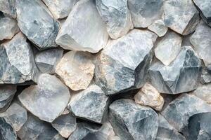 A close up of a stone wall with many different types of rocks photo
