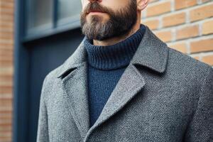 A man with a beard and a sweater photo