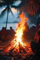 Beach bonfire burns bright. Orange flames rise up. Palm trees stand tall near ocean. Aborigine People gather around fire at night. Warm glow and relaxing light. photo