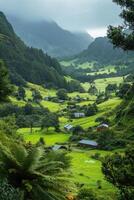 Green valley view. Mountains covered by forest and grass. Some cabins on the grass in valley. Natural scenery. Overcast day. photo