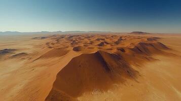 Desert landscape. Sand dunes under clear sky. Aerial view of arid land. Dry and hot climate. Empty place. photo