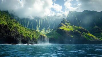 Green mountains meet blue ocean. Waterfall flows from cliffs. Sunlight shines on the landscape. Clouds are low on peaks. Water runs into sea. photo
