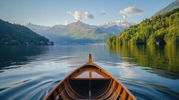 Boat sailing on lake. Mountain view with forest and sky reflection on water. Calm scenic landscape. Summer vacation background. photo