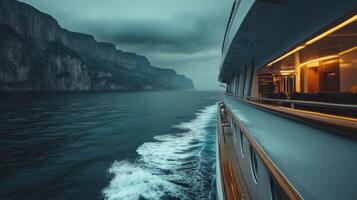 Luxury Yacht Sailing. Cliffs on the horizon. Blue sea water and clouds. Boat trip at sea. Ocean travel adventure. Calm sea view. photo