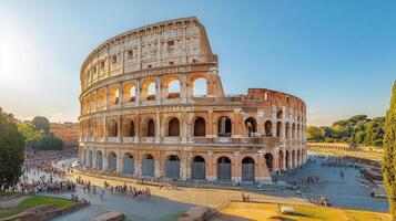 Large stone building. Ancient arches and walls. Crowd of people walking. Sunny day. Travel. Summer. Tourist destination. Old monument. Historic architecture. Sightseeing. photo