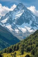 Tall mountain peak rises above green trees. Snow covers top. Blue sky and white clouds above mountain. Forest on hills. Sunny day. photo
