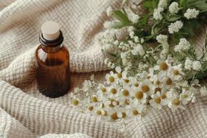 Amber bottle with cork top lies near small white flowers on a beige textured blanket in soft light. Aromatic natural beauty concept. photo