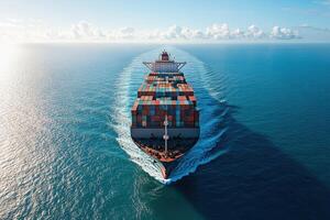 Large cargo ship sailing on bright blue ocean water. Container vessel transporting goods leaving wake behind. Sunny sky with clouds above the ocean. photo