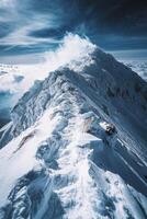 Snowy mountain peak under cloudy sky. Ridge covered in ice. White cloud at top. Winter landscape. High altitude scene. Majestic and cold. photo