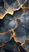 Dark blue stone background with golden cracks. Abstract texture of rock with light veins. Luxury marble surface. Decorative stone pattern photo