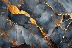 Gray stone texture with gold cracks. Abstract rock surface with bright veins. Dark blue stone background. Mineral pattern with golden lines. photo