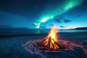 Campfire burning brightly on a snowy beach under a vibrant aurora borealis at night with mountains and ocean in the background photo