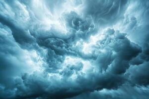 Dramatic storm clouds gather tightly. Ominous dark grey nimbus sky. Light shines through intense cloudscape. Impending weather front. Moody atmospheric background. photo