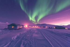 Snowy landscape at night. Northern lights in the sky. Small buildings in the arctic. Snow covered road. Distant mountains background. photo