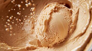 An ice cream scoop is being poured into a bowl photo