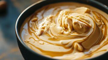A cup of coffee with peanut butter and caramel photo