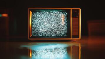 An old television is lit up with a glowing screen photo