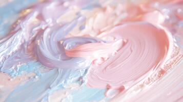 A close up of a pink and blue paint on a surface photo