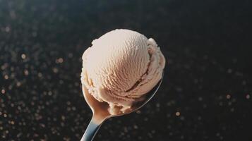A spoon with a scoop of ice cream on top photo