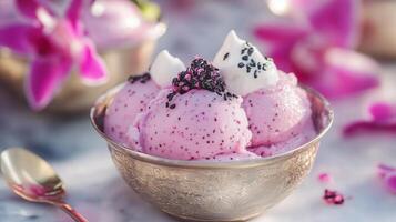 A bowl of ice cream with pink and white toppings. photo