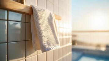 Close-up of a white bathroom wall with square tiles photo