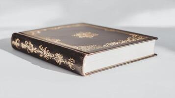 An old book with gold foil on it photo