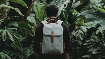 A man with a backpack in the jungle photo