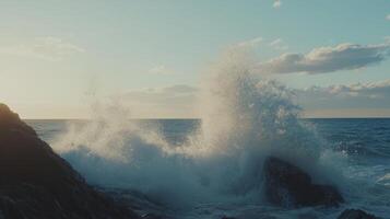 A large wave crashing into the ocean photo