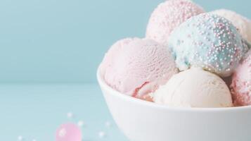 A bowl filled with ice cream and pink and blue balls photo