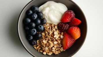 A bowl of yogurt, berries, and granola photo