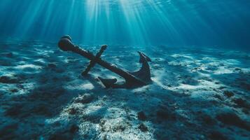 Anchor and anchor in the ocean photo