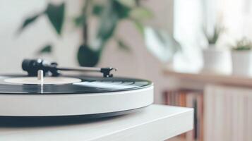 A record player sitting on a table in front of a plant photo