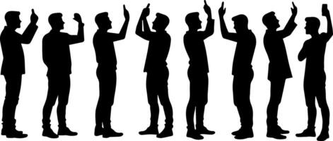 Silhouettes of men standing in a line with their hands up vector