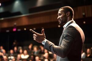 Motivational speaker gesturing while giving a business presentation to audience photo