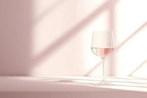 Glass of rose wine resting on table in sunlight beams photo