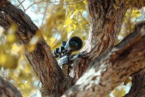 Sniper rifle with scope aiming through tree branches photo