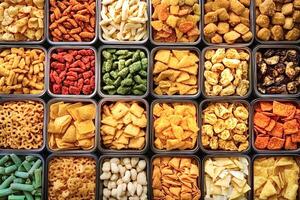 Variety of crunchy snacks displayed in square containers photo