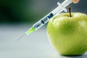 Syringe injecting green apple gmo food concept photo