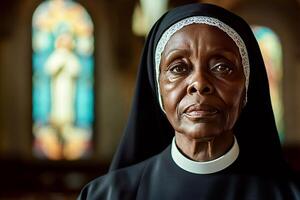 Portrait of senior african nun posing in church with stained glass window photo