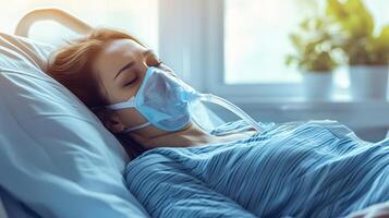 Sick patient wearing oxygen mask resting in hospital bed photo