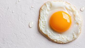 Fried Egg on Textured Background with Copyspace Culinary Art Minimalist Style photo
