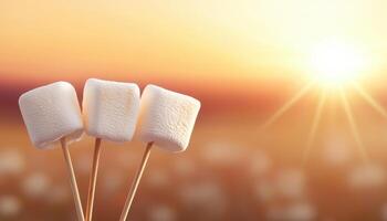 Roasting Marshmallows on Skewers Against a Warm Sunset Background with Copyspace photo