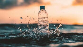 Dynamic Splash of a Plastic Water Bottle at Sunset Nature Background Copyspace photo